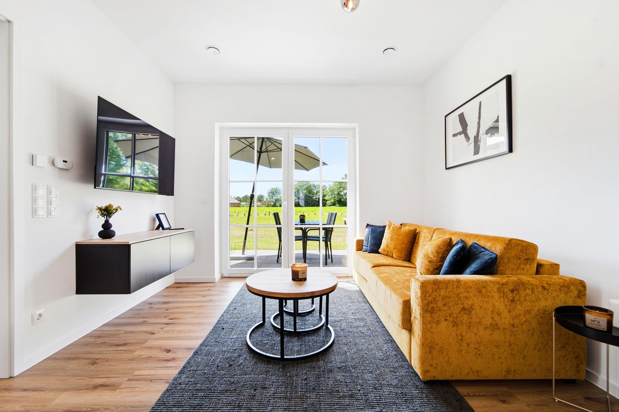 Wohnzimmer mit direktem Zugang zur Terrasse